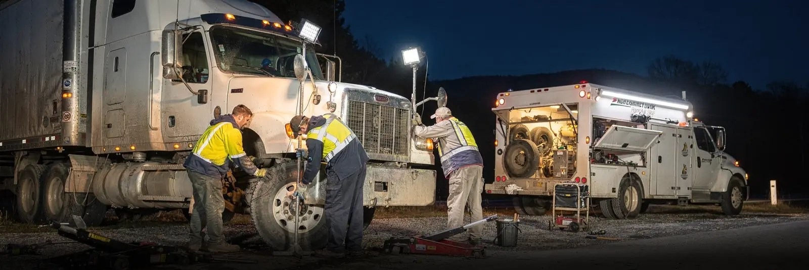 CPA Truck and Trailer Services mechanics performing mobile semi truck repair at night in Harper, WV